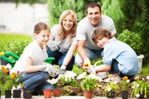 Portrait of a family gardening.
